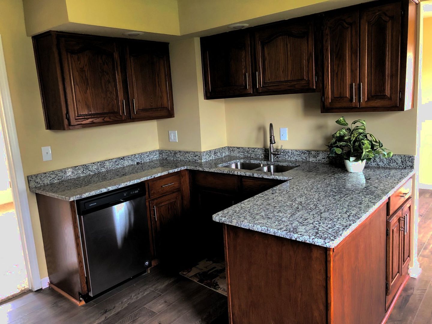 110 McKool Avenue Romeoville, IL 60446 - Photo 4 of 17 a kitchen with granite countertop wood cabinets and a sink