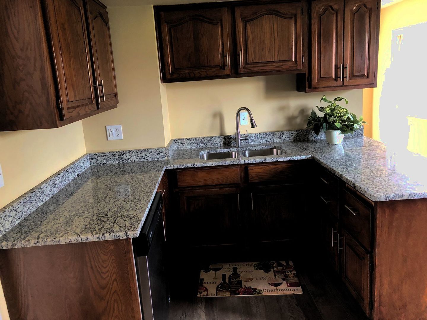 110 McKool Avenue Romeoville, IL 60446 - Photo 5 of 17 a kitchen with granite countertop stainless steel appliances a sink dishwasher stove and cabinets