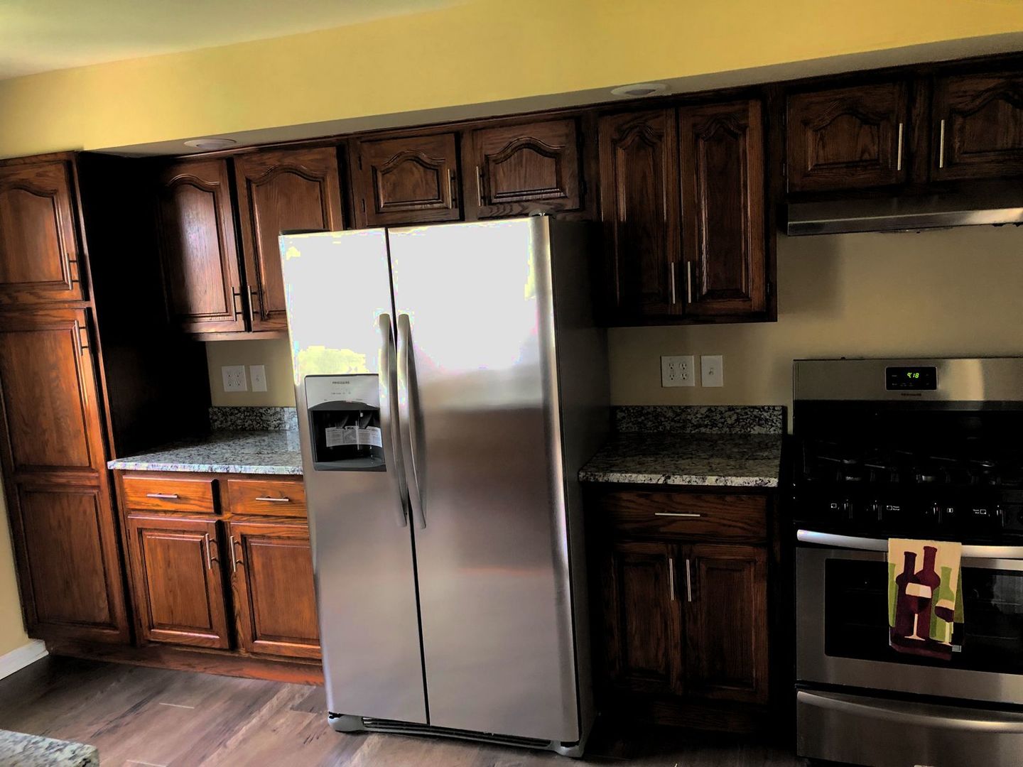 110 McKool Avenue Romeoville, IL 60446 - Photo 6 of 17 a kitchen with stainless steel appliances granite countertop a refrigerator and a stove
