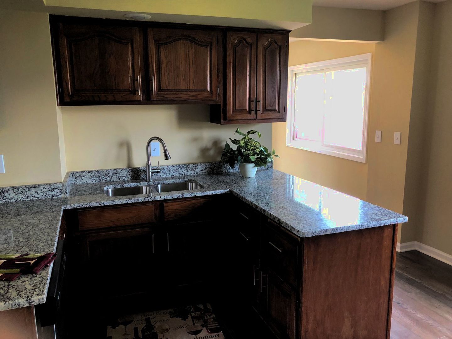110 McKool Avenue Romeoville, IL 60446 - Photo 7 of 17 a kitchen with granite countertop a sink a stove and cabinets
