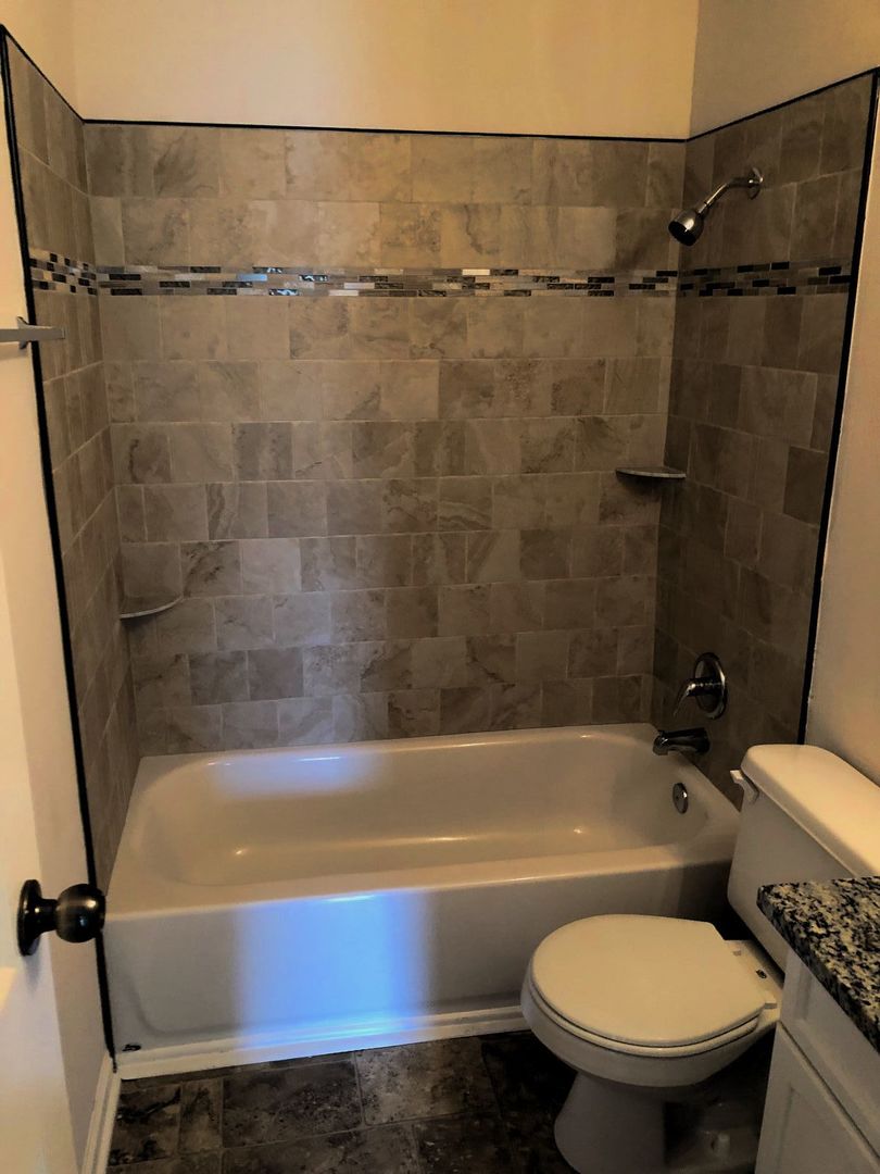 110 McKool Avenue Romeoville, IL 60446 - Photo 9 of 17 a bathroom with a sink and a bathtub