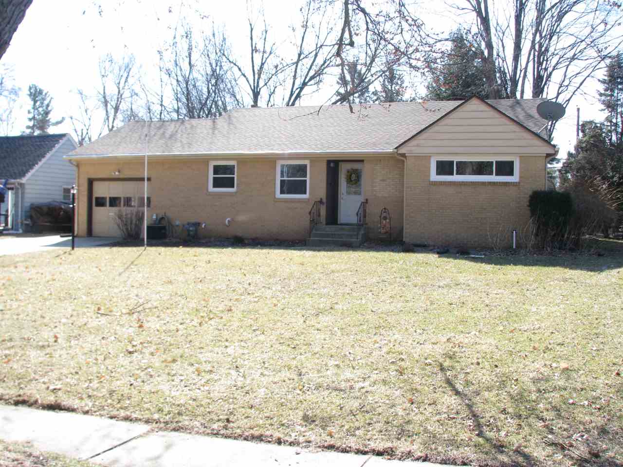 4009 Pinecrest Road Rockford, IL 61107 - Photo 1 of 20 a front view of a house with a yard
