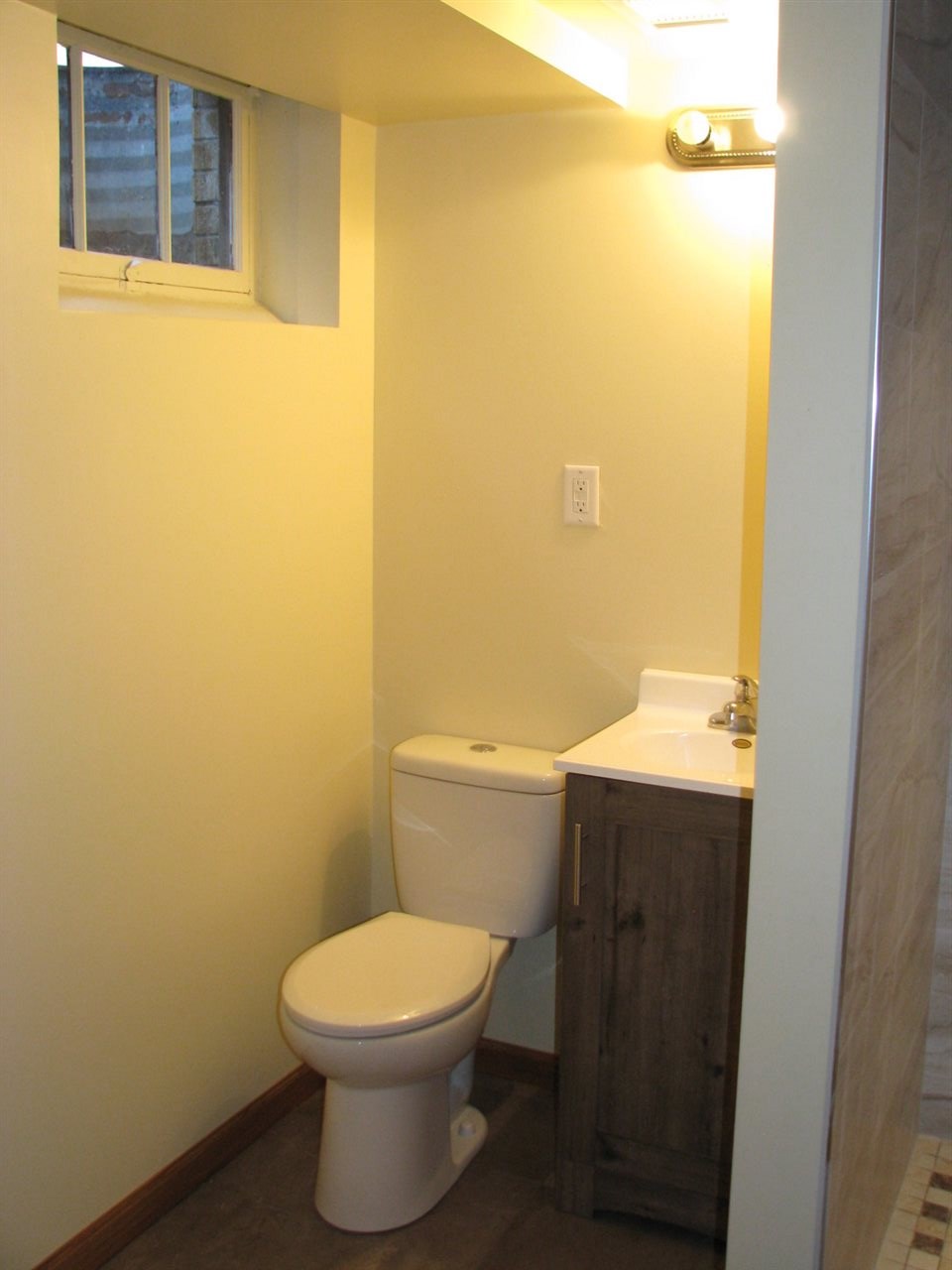 4009 Pinecrest Road Rockford, IL 61107 - Photo 19 of 20 a bathroom with a sink and a toilet