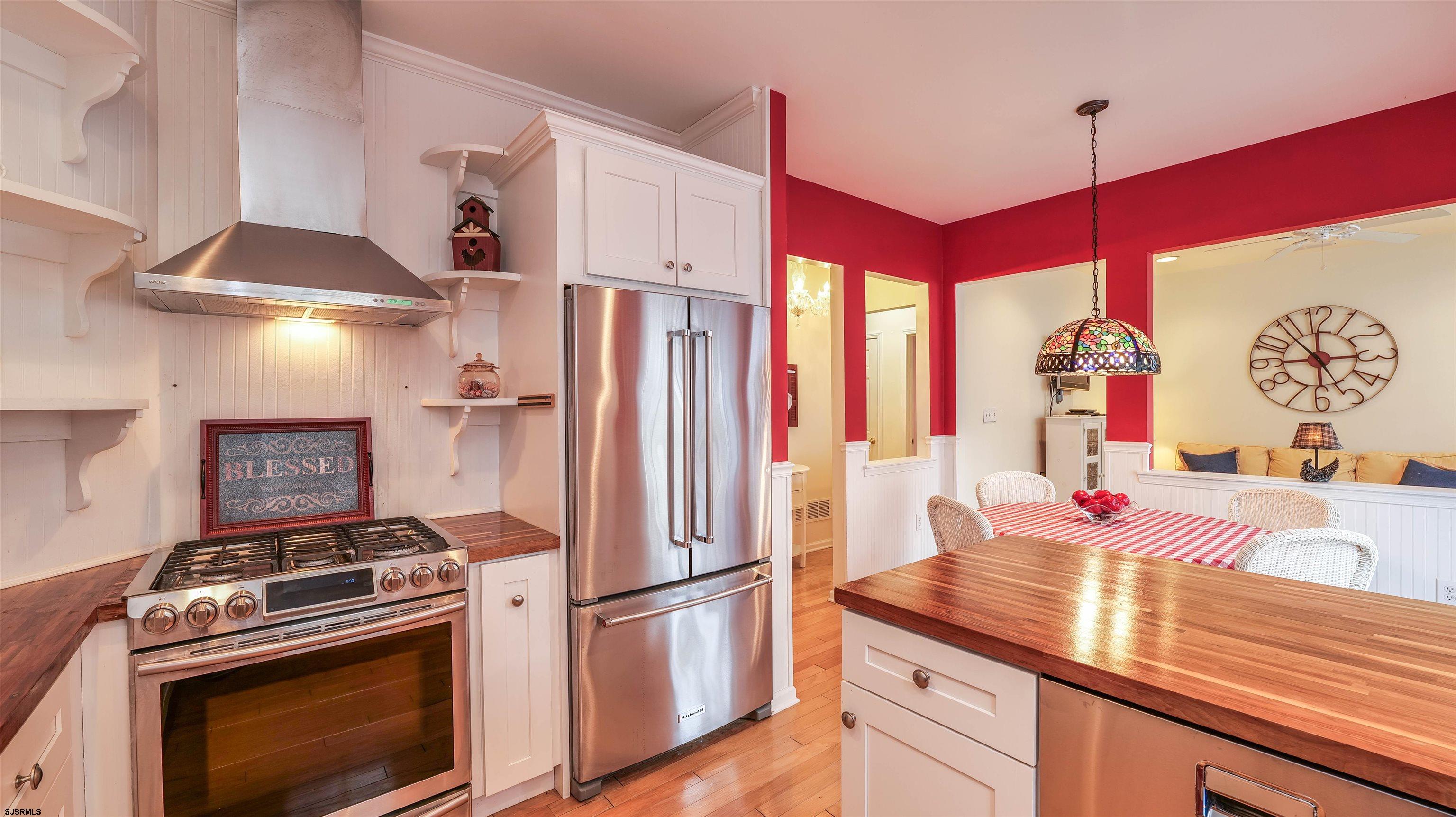 42 Ables Run Drive Absecon, NJ 08201 - Photo 16 of 43 a kitchen with stainless steel appliances granite countertop a sink a stove and a refrigerator