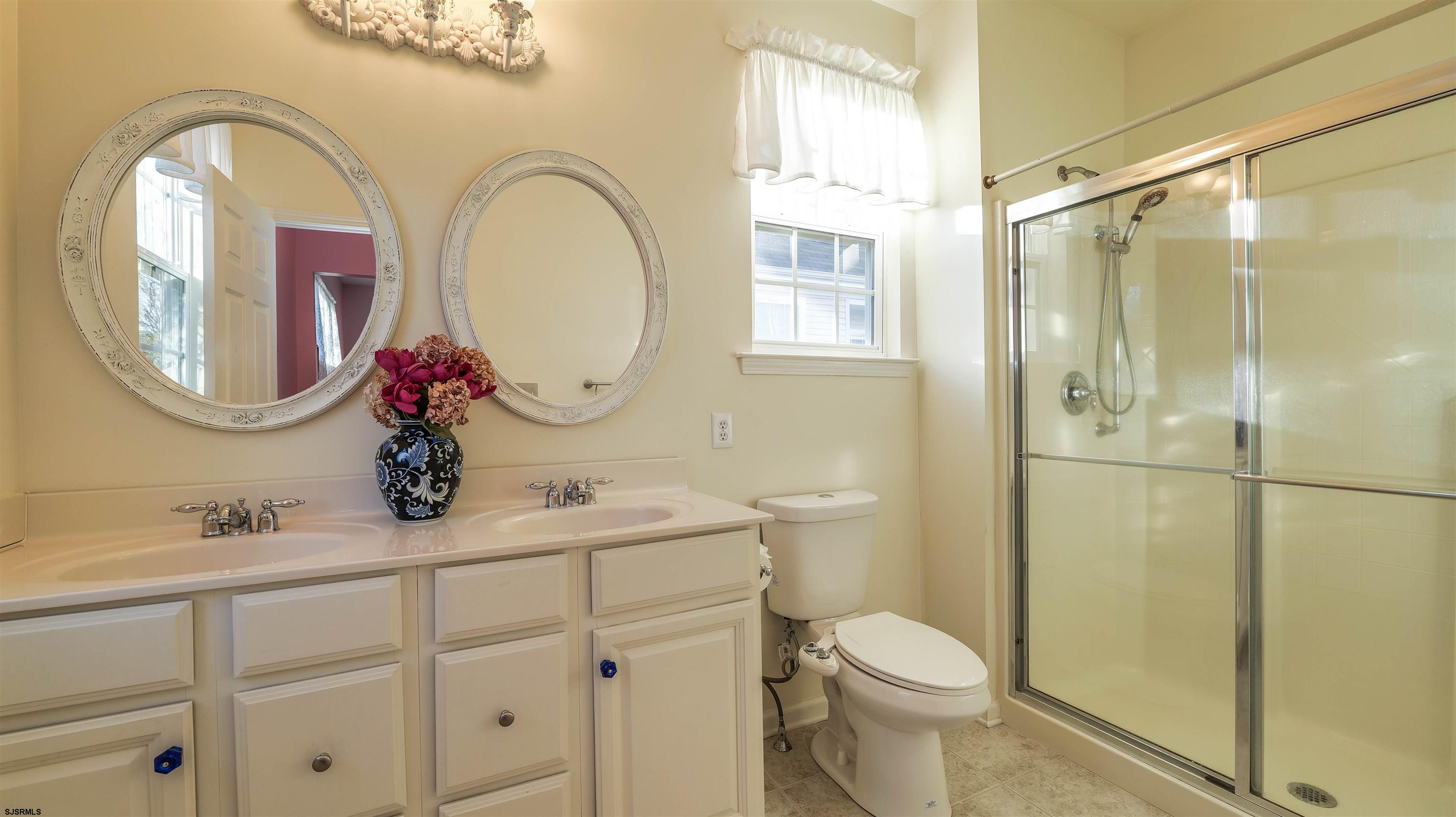 42 Ables Run Drive Absecon, NJ 08201 - Photo 21 of 43 a bathroom with a toilet a sink and a mirror