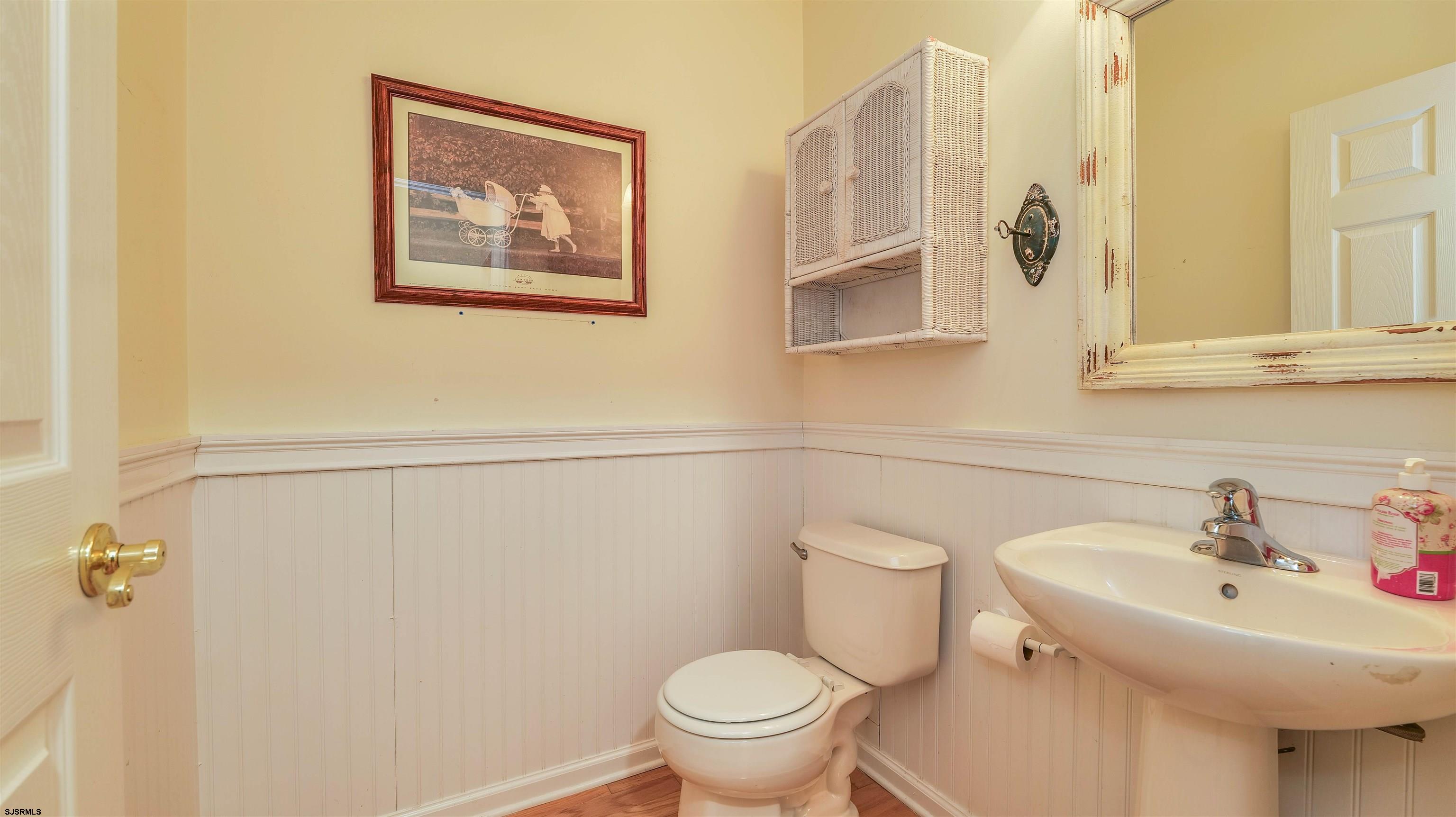 42 Ables Run Drive Absecon, NJ 08201 - Photo 24 of 43 a bathroom with a toilet sink and mirror