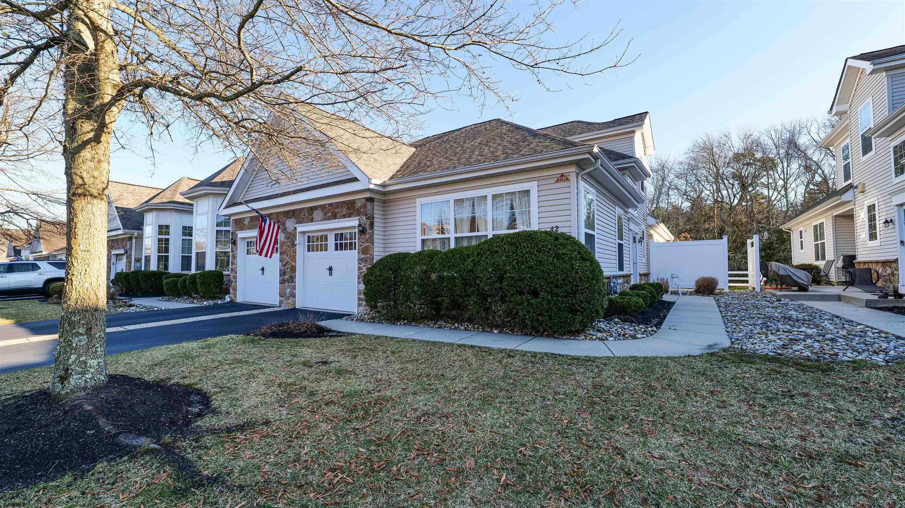 42 Ables Run Drive Absecon, NJ 08201 - Photo 3 of 43 a front view of a house with a garden