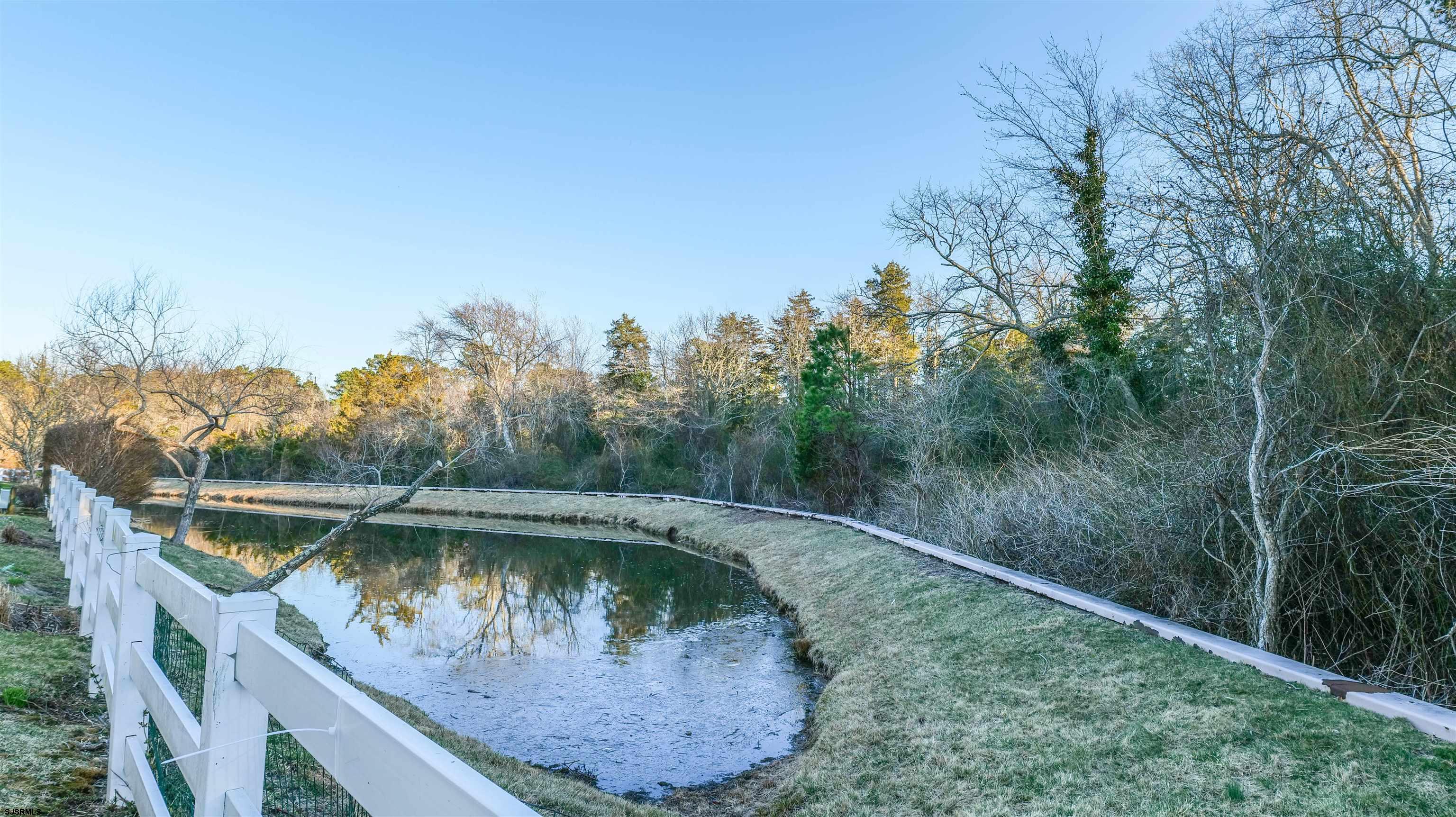 42 Ables Run Drive Absecon, NJ 08201 - Photo 39 of 43 a view of a wooden deck with a lake view