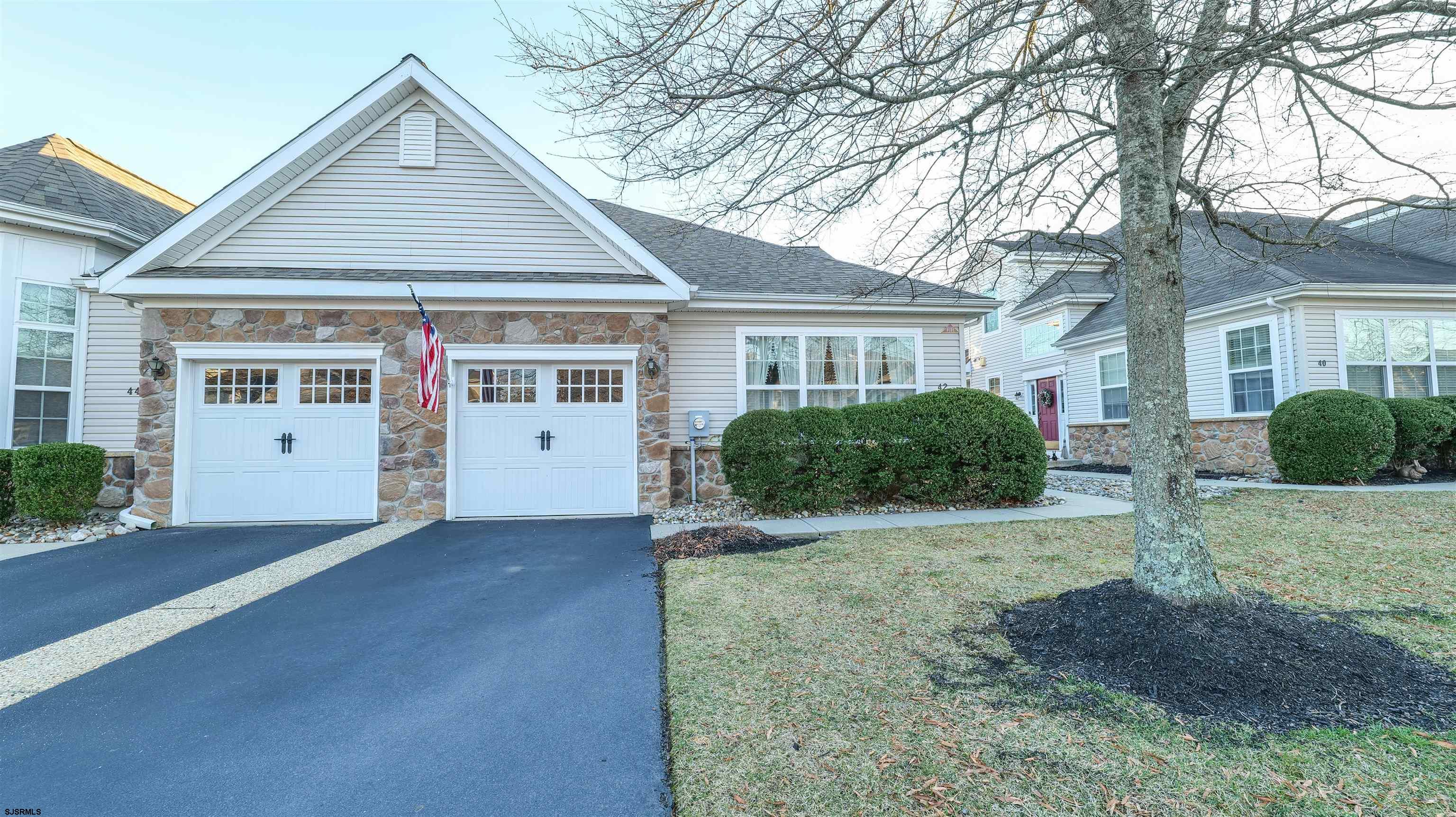 42 Ables Run Drive Absecon, NJ 08201 - Photo 41 of 43 a front view of a house with a yard and garage