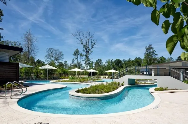 a view of a swimming pool with outdoor seating