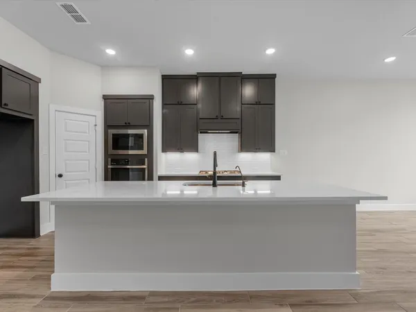 a view of a kitchen with a sink