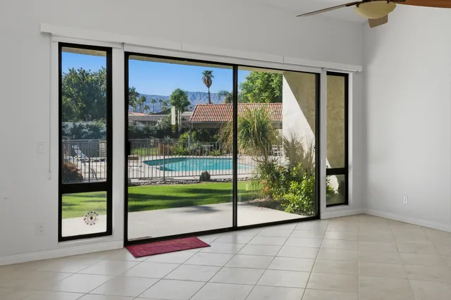 a view of porch with a floor to ceiling window and room