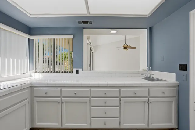 a bathroom with a sink and mirror