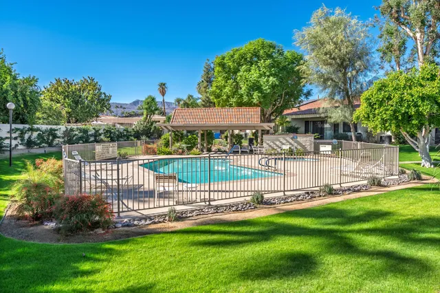 a view of a house with a yard and a table