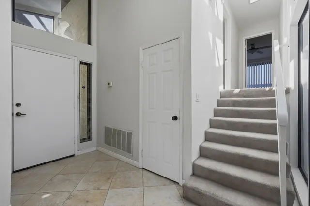 a view of an entryway with hallway
