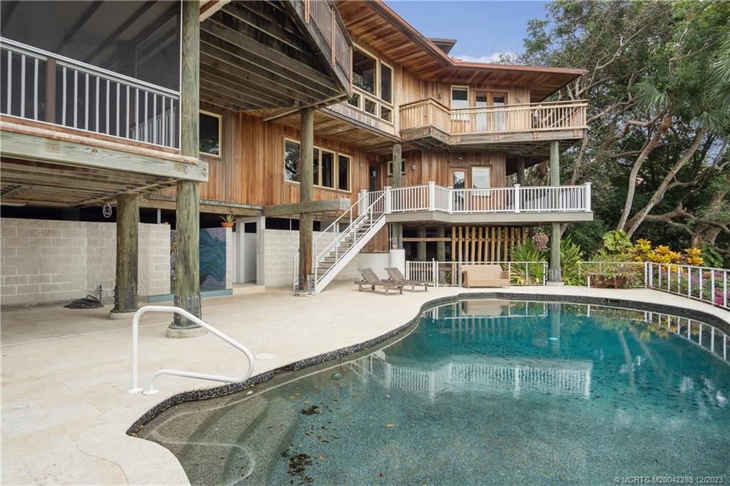 45 West High Point Road Stuart, FL 34996 - Photo 21 of 29 Pool Area/Back of house