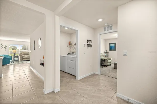 a view of a hallway with living room