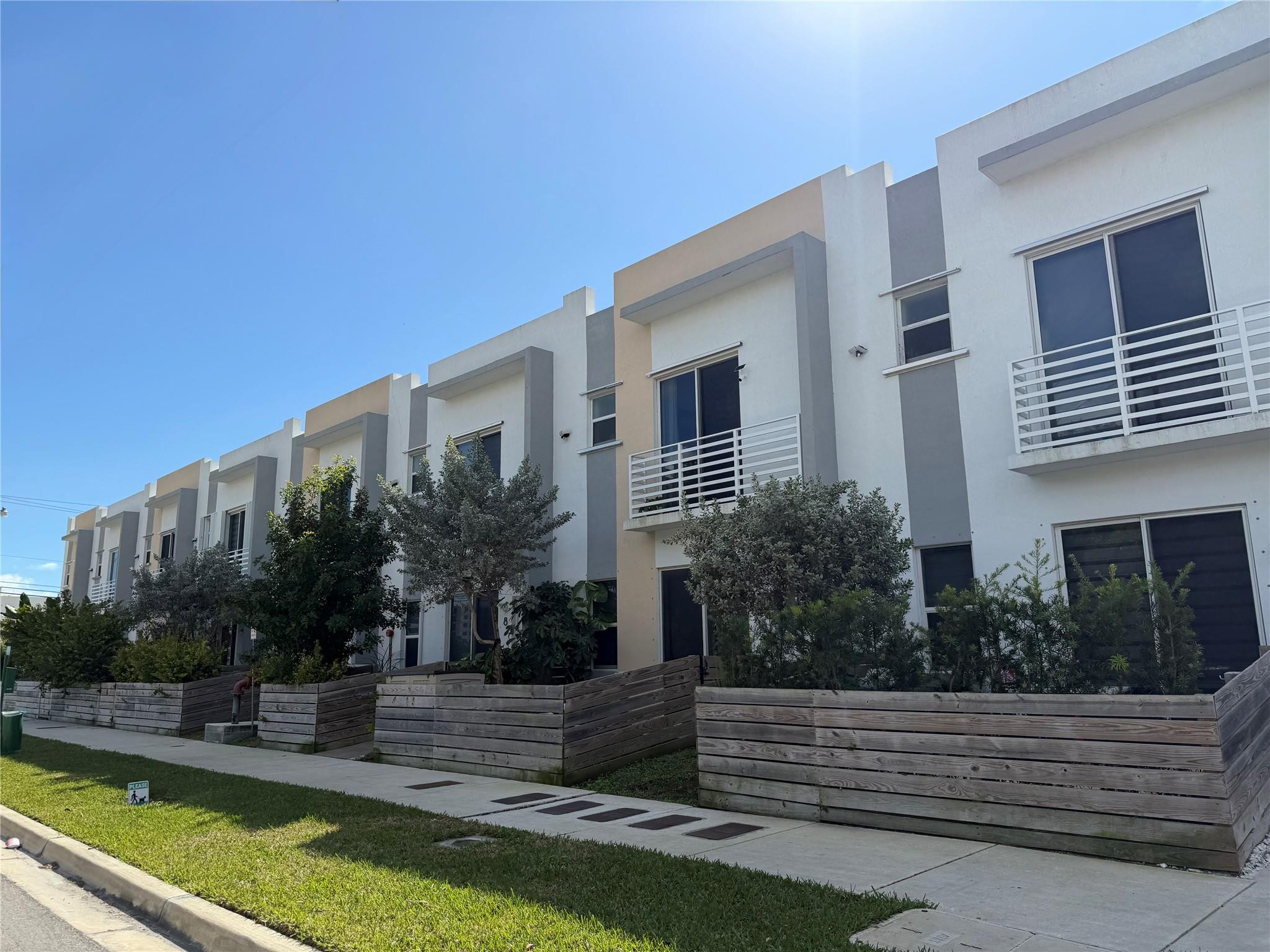 a view of house with yard and outdoor seating