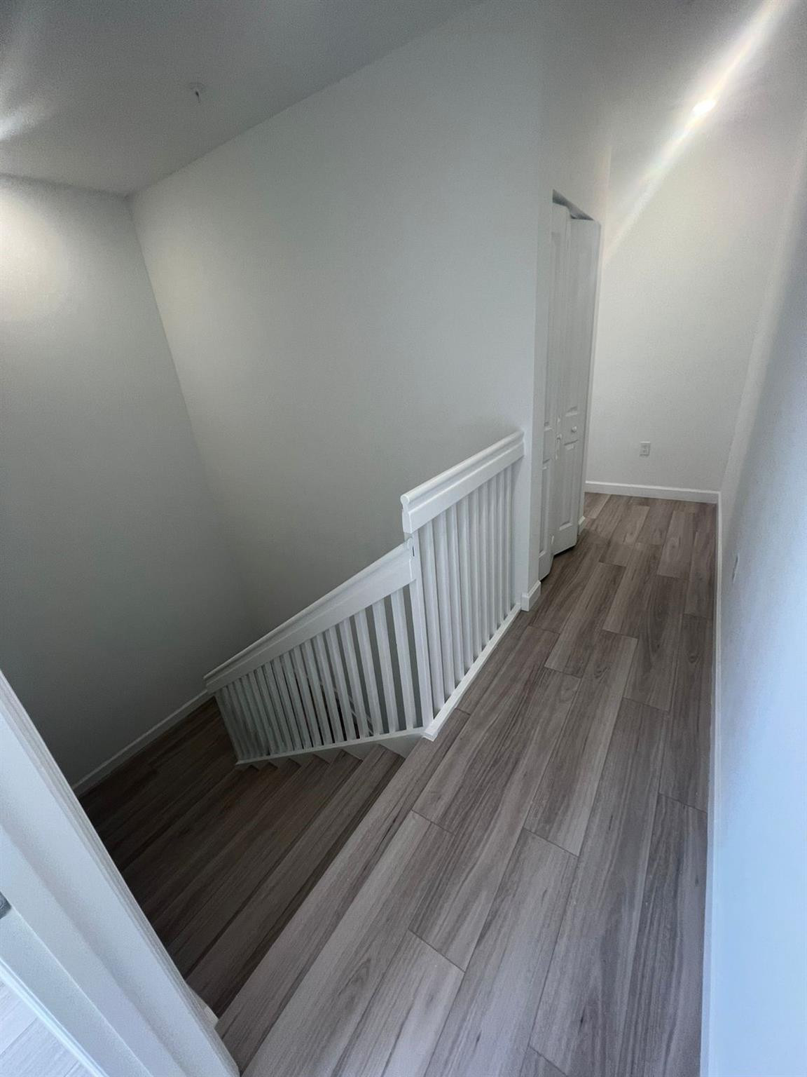 24650 Southwest 129th Avenue Homestead, FL 33032 - Photo 5 of 15 a view of hallway with wooden floor