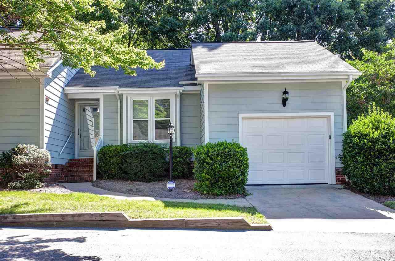 1500 Ferncliff Circle Raleigh, NC 27609 - Photo 1 of 25 a view of a white house with a small yard plants and a large tree