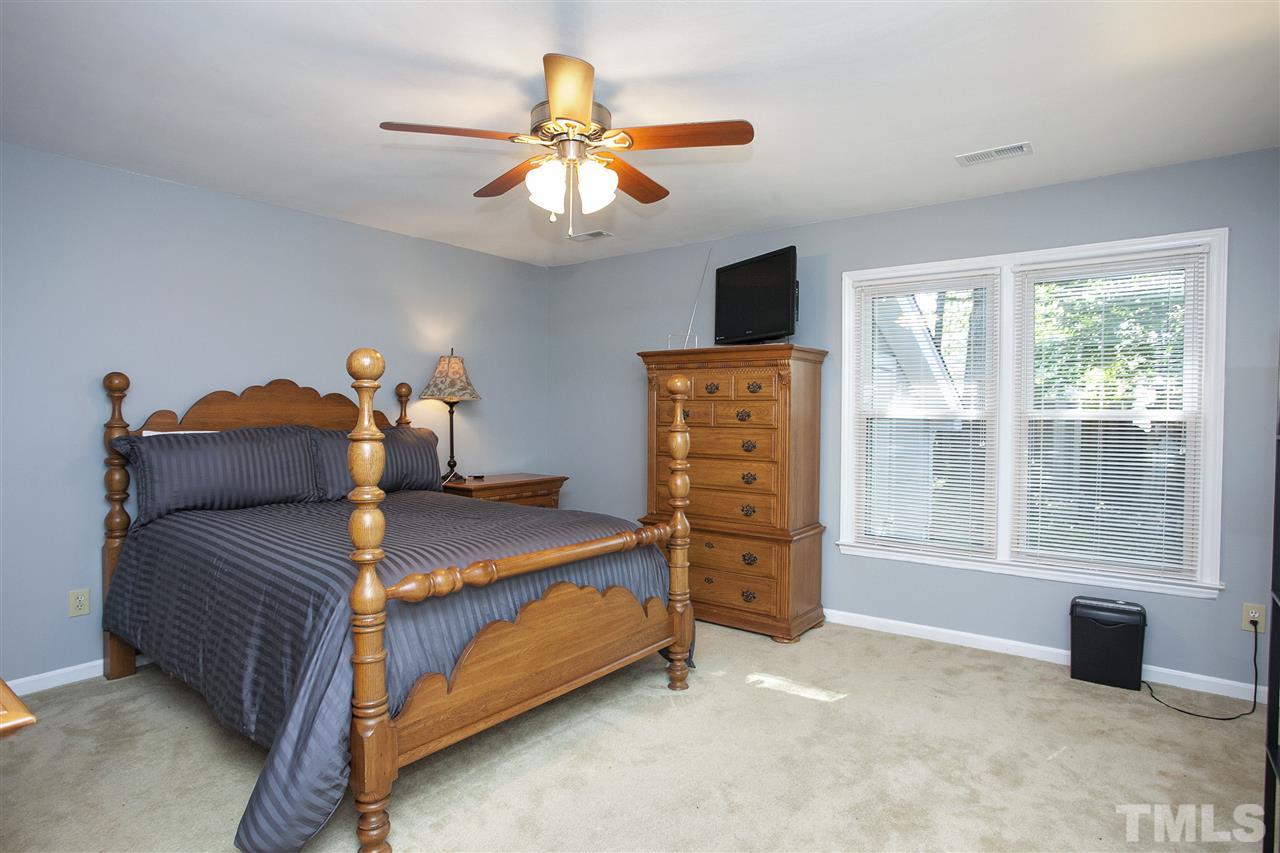 1500 Ferncliff Circle Raleigh, NC 27609 - Photo 11 of 25 a bedroom with a bed and a large window