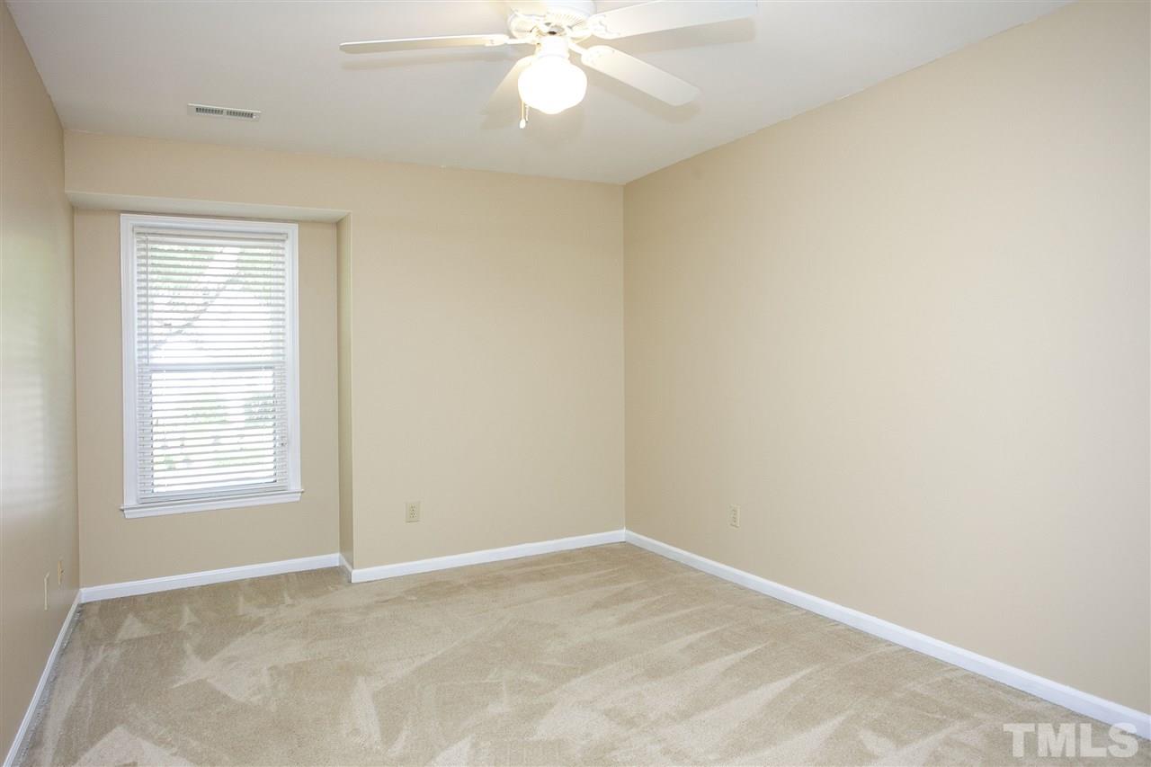 1500 Ferncliff Circle Raleigh, NC 27609 - Photo 17 of 25 an empty room with windows and fan