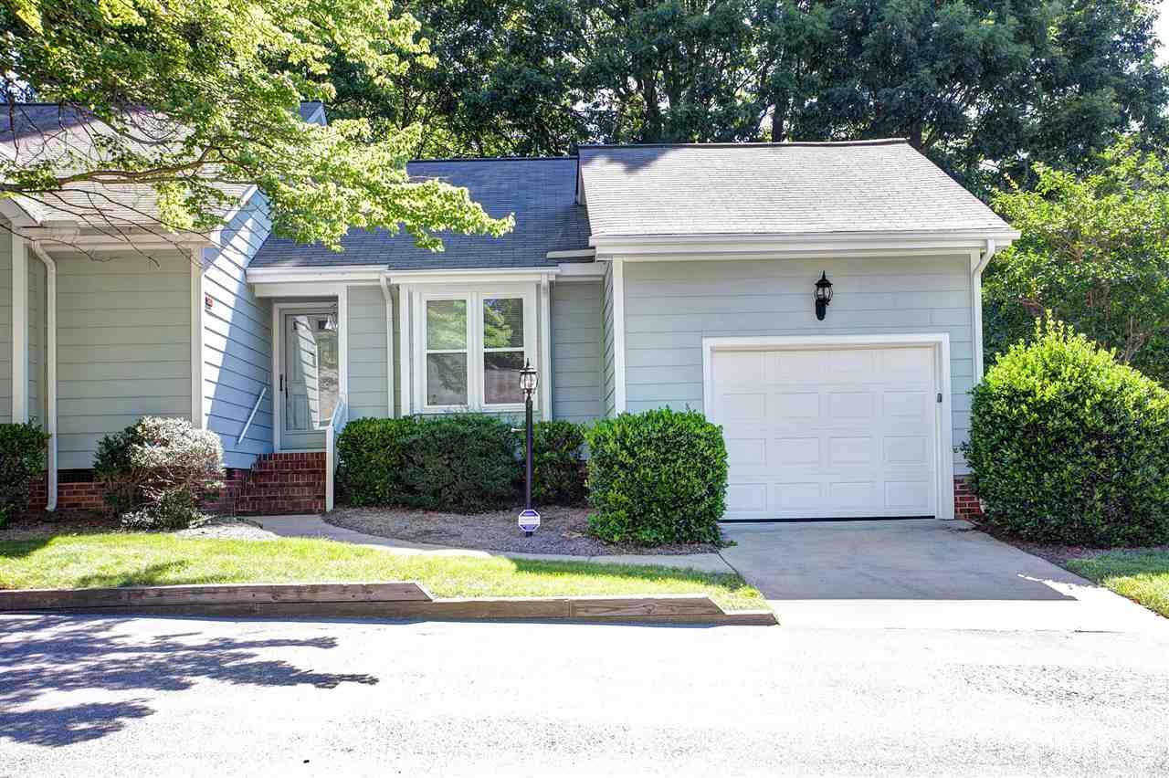 1500 Ferncliff Circle Raleigh, NC 27609 - Photo 18 of 25 a view of a house with a yard and large tree and plants