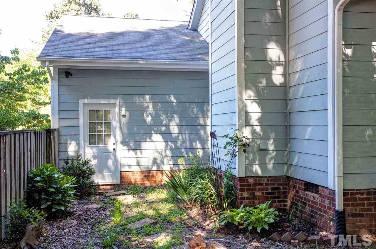 1500 Ferncliff Circle Raleigh, NC 27609 - Photo 19 of 25 a view of a house with a small yard and plants