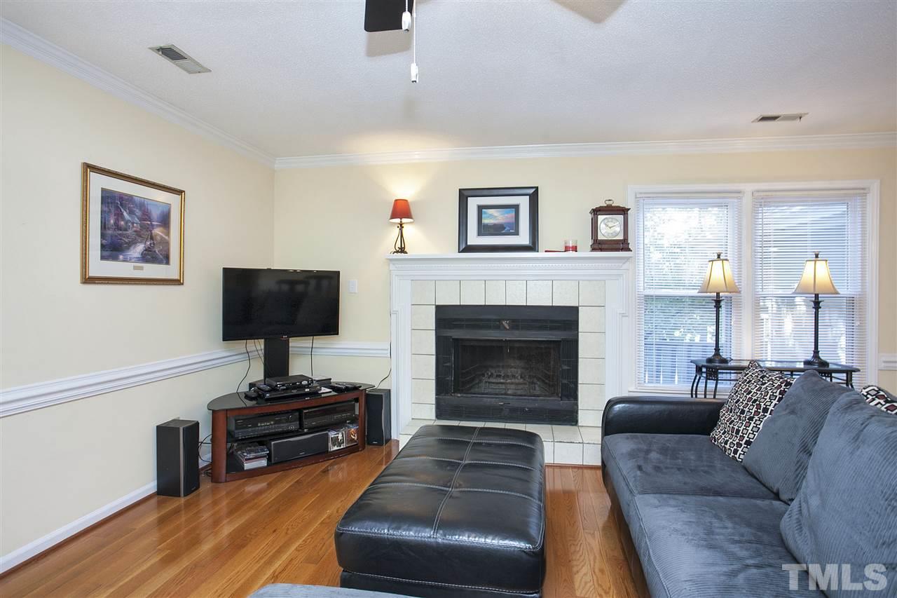 1500 Ferncliff Circle Raleigh, NC 27609 - Photo 4 of 25 a living room with furniture and a fireplace