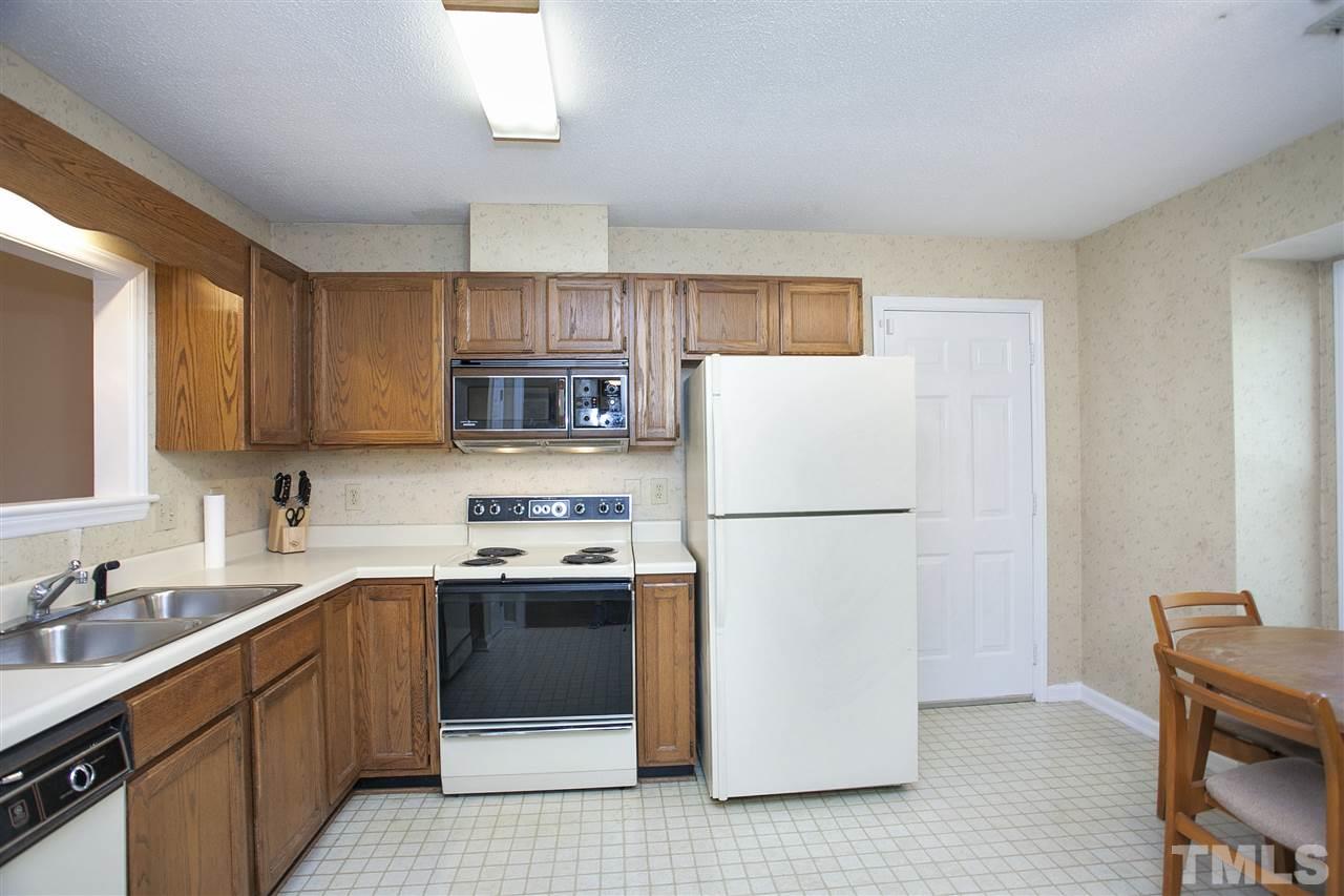 1500 Ferncliff Circle Raleigh, NC 27609 - Photo 8 of 25 a kitchen with stainless steel appliances a refrigerator sink and microwave