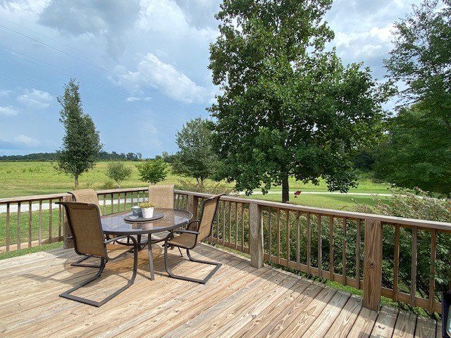 3764 Decherd Estill Road Winchester, TN 37398 - Photo 14 of 29 a view of a deck with chairs and wooden floor
