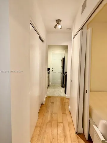 a view of a bathroom from the hallway