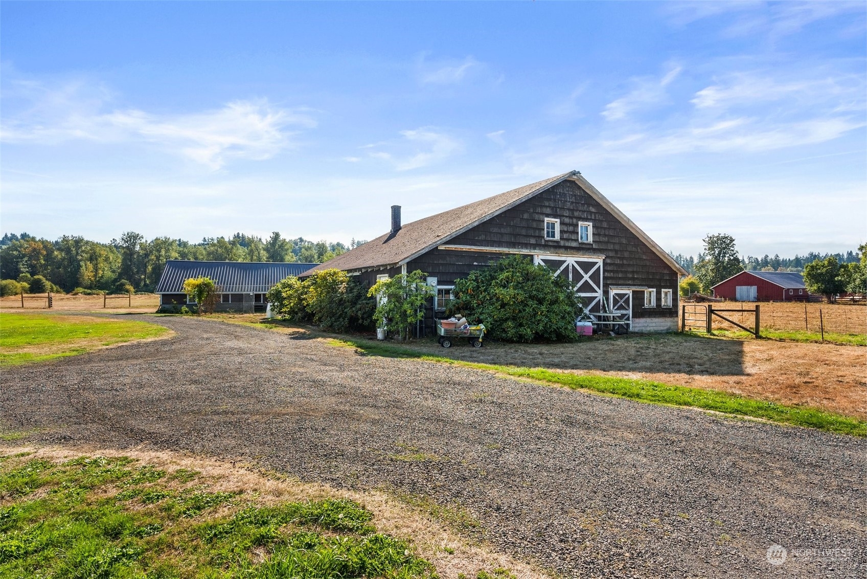 10441 Independence Road Southwest Rochester, WA 98579 - Photo 3 of 33 a view of a house with swimming pool and a yard