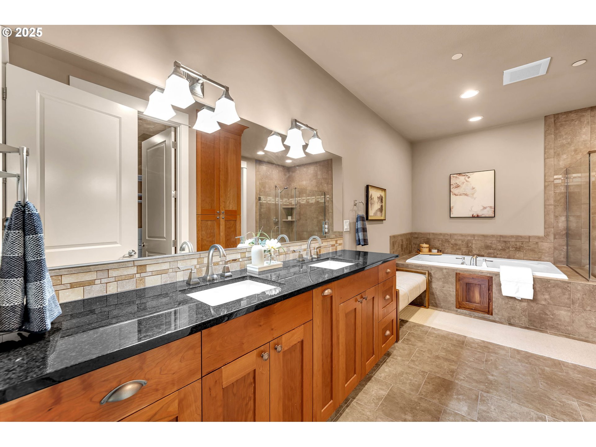 4029 Northwest 77th Avenue Camas, WA 98607 - Photo 18 of 33 a large white kitchen with a large island in the center and stainless steel appliances