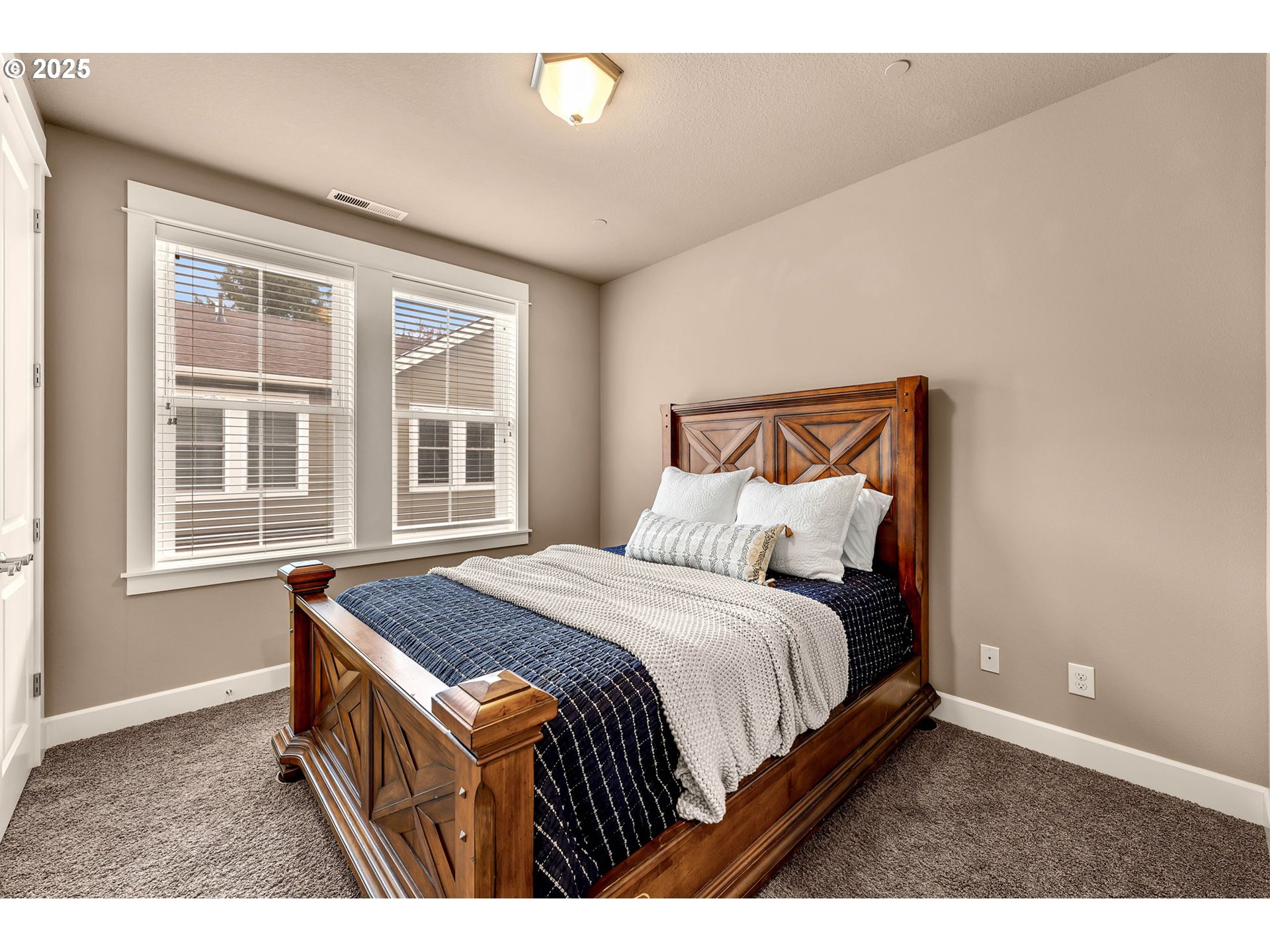 4029 Northwest 77th Avenue Camas, WA 98607 - Photo 25 of 33 a bedroom with a bed a dresser and windows