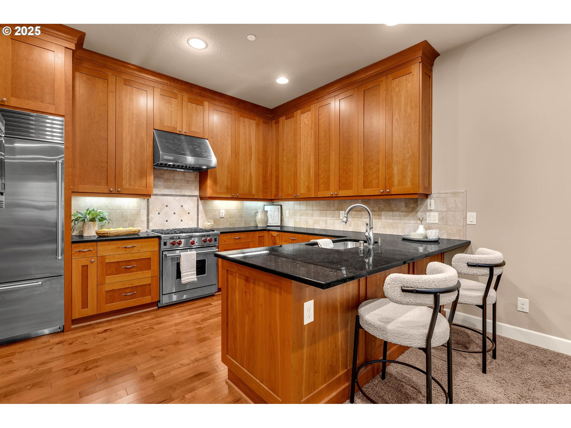4029 Northwest 77th Avenue Camas, WA 98607 - Photo 10 of 33 a kitchen with stainless steel appliances granite countertop wooden cabinets a sink and a stove