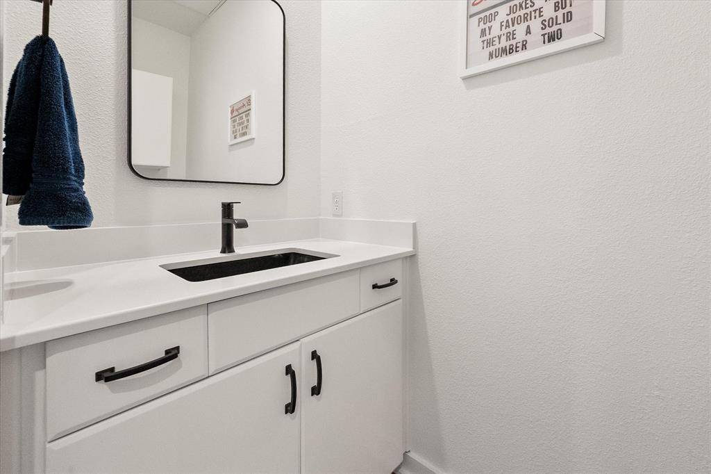6907 Sumner Street The Colony, TX 75056 - Photo 17 of 33 Convenient half bathroom on the 2nd floor.