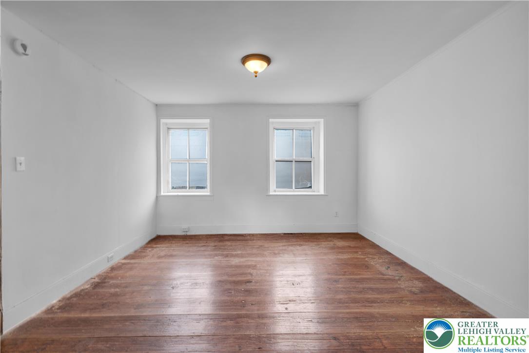 4828 Huckleberry Road Orefield, PA 18069 - Photo 22 of 41 a view of a room with wooden floor and windows