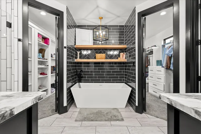 a bathroom with a bathtub and shower