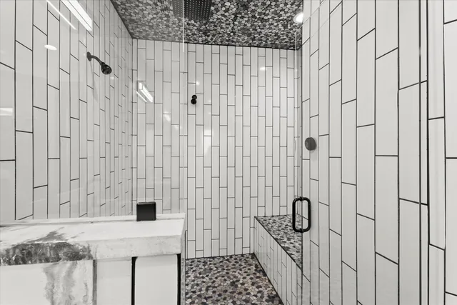 a bathroom with a shower curtain and a sink