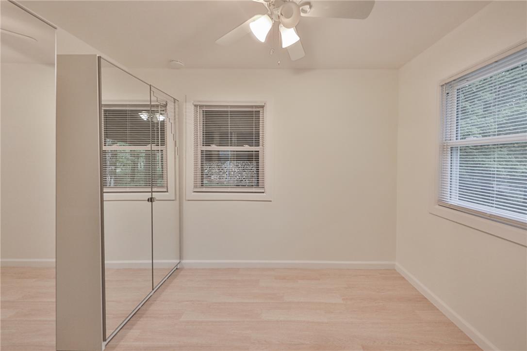 5599 Minks Pond Road Bushkill, PA 18324 - Photo 39 of 64 Bright and airy, this bedroom features resilient vinyl flooring and a refreshing ceiling fan for comfort.