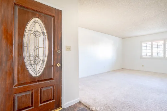 an empty room with windows mirror and windows