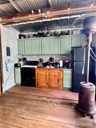 a kitchen with a stove and a microwave