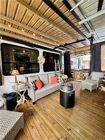 a living room with furniture and flat screen tv