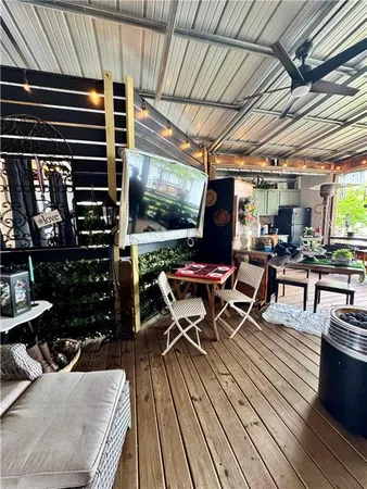 a outdoor space with lots of furniture and wooden floor