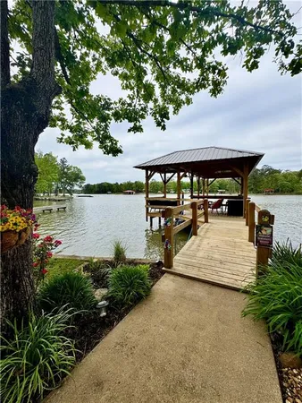 a view of a house with lake outdoor space and sitting space