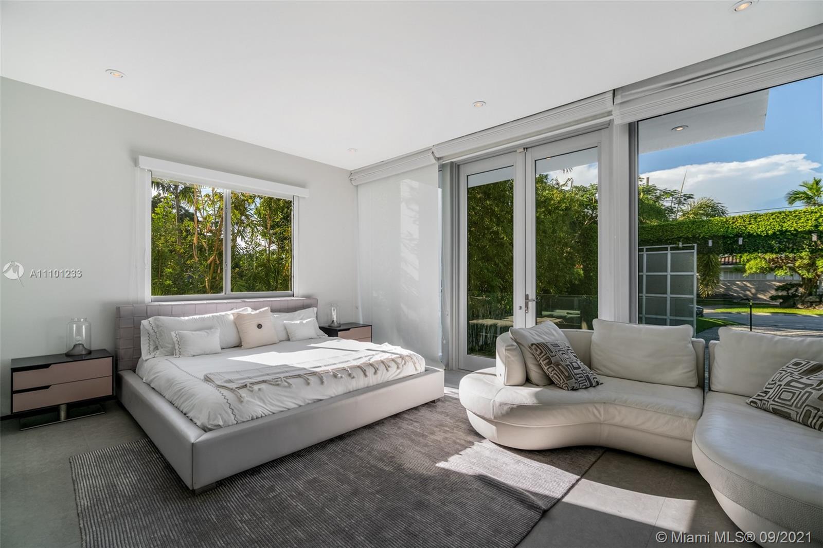 1236 Biscaya Drive Surfside, FL 33154 - Photo 17 of 40 a living room with furniture and a large window