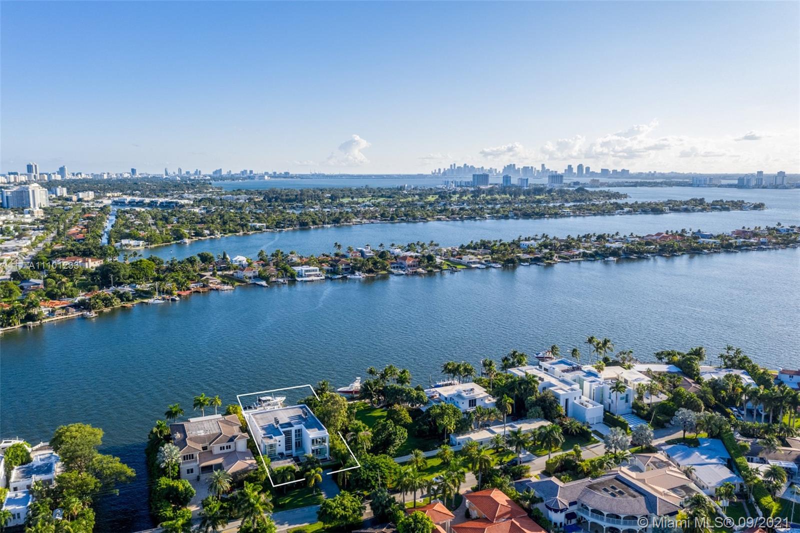 1236 Biscaya Drive Surfside, FL 33154 - Photo 30 of 40 a view of a lake with a city