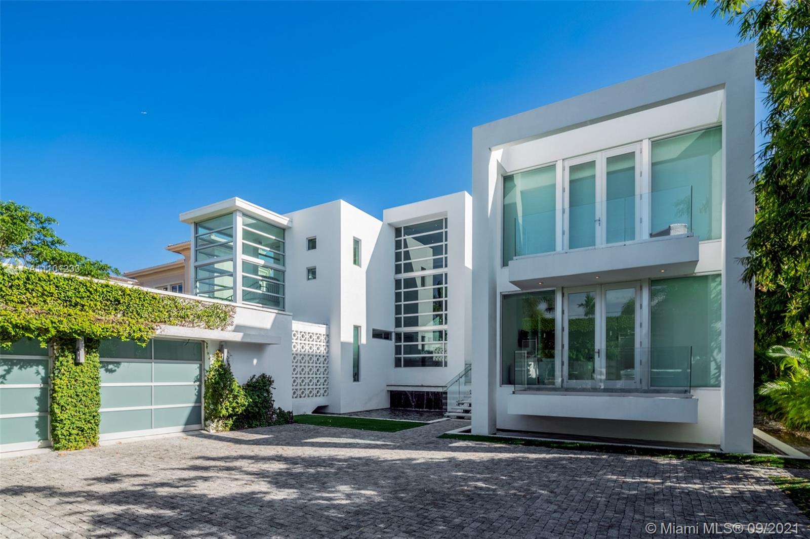 1236 Biscaya Drive Surfside, FL 33154 - Photo 33 of 40 a view of a building with a garden