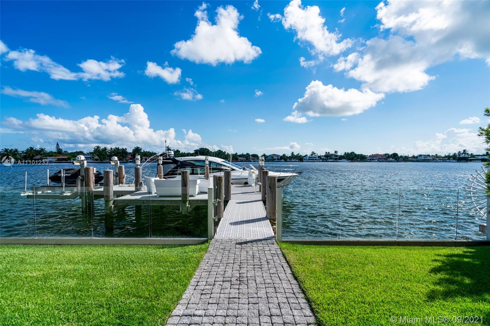 1236 Biscaya Drive Surfside, FL 33154 - Photo 34 of 40 a view of a lake with a garden